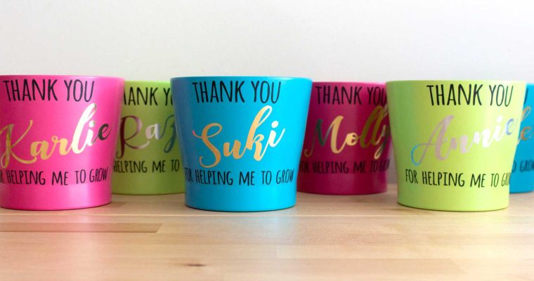 teacher's gifts: plant pots decorated with vinyl lettering which says 'thank you (name) for helping me grow'